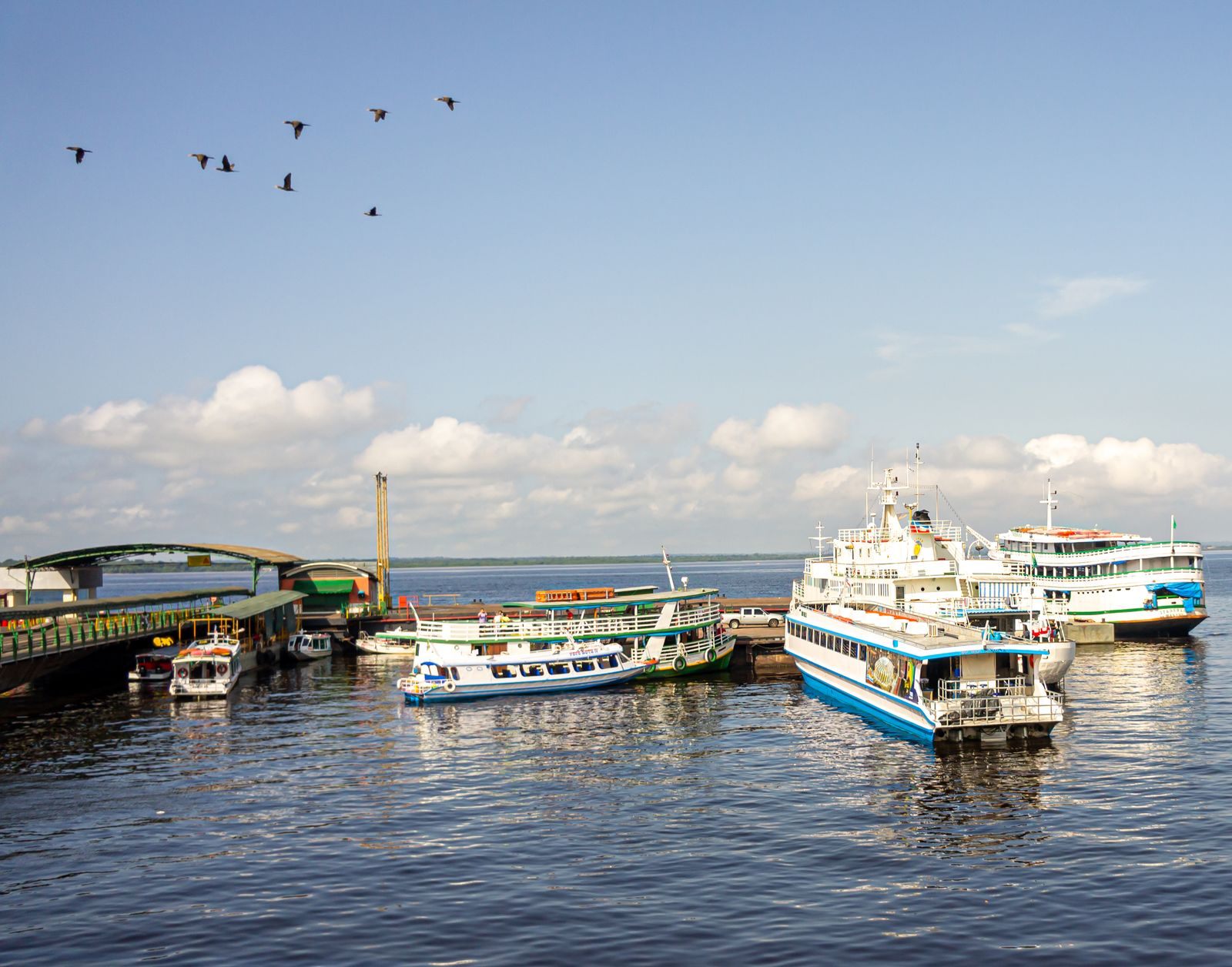 Passenger boats docked in the harbor at Manaus, Brazil, a hub for the best South America river cruises